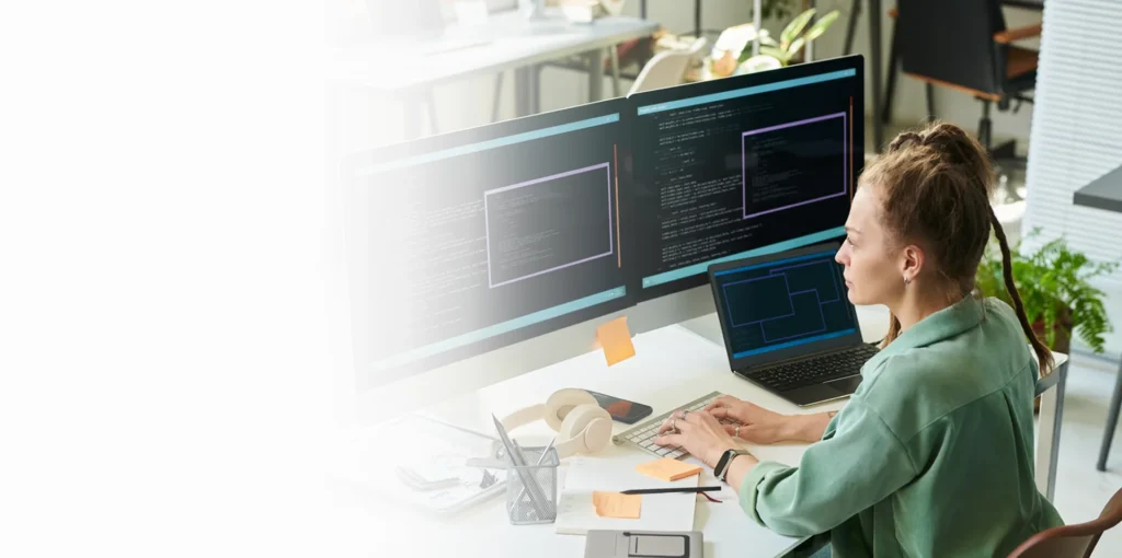Security analyst monitoring code on multiple screens, cybersecurity services Honolulu