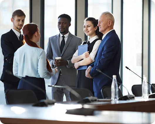 Business team talking in a boardroom, managed cybersecurity services