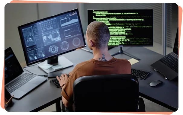 Security analyst monitoring threat dashboards on multiple screens, cybersecurity services Lafayette