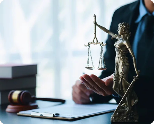 Lady Justice statue and gavel on a lawyer's desk, cybersecurity for Atlanta law firms