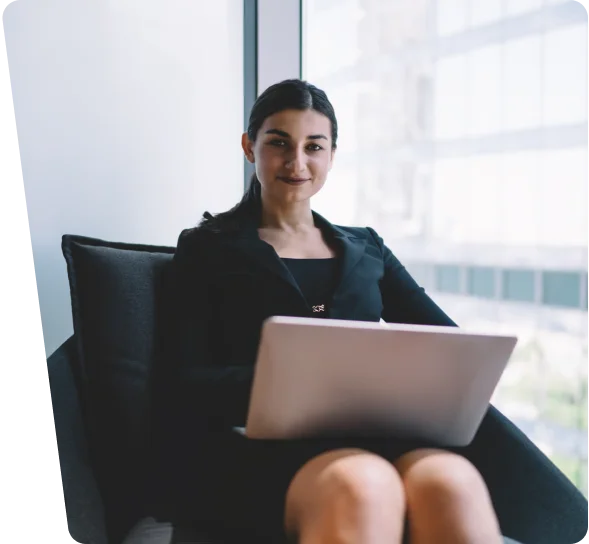 Businesswoman seated with a laptop in an office, cybersecurity services in Tampa